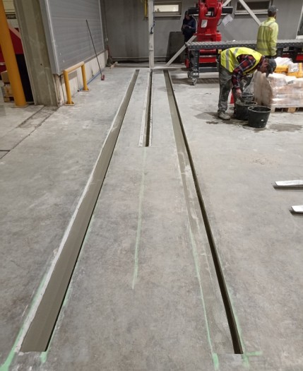 GROOVES IN CONCRETE AND POURING RAILS